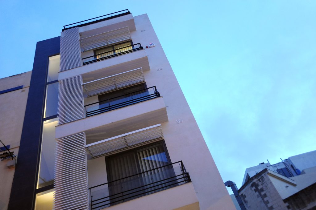 CMS House against a clear Maltese sky