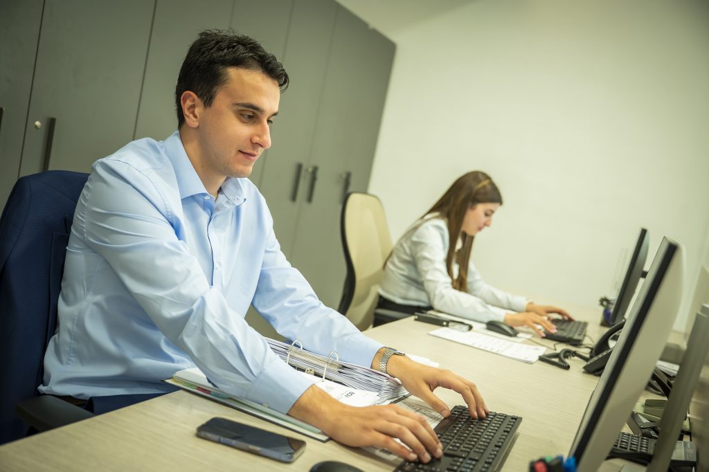 An accountant working through a client’s books at CMS House